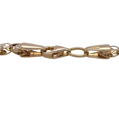 This pre-owned 9ct yellow and white gold flower-style bracelet is a decorative two-tone design, featuring floral-inspired links throughout.

Design: Featuring a flower-style link design, this bracelet combines warm yellow gold with contrasting white gold detailing for a decorative two-tone appearance.
Material: Made from 9-carat yellow and white gold.
Bracelet Detail: The flower-style links measure approximately 4mm wide.