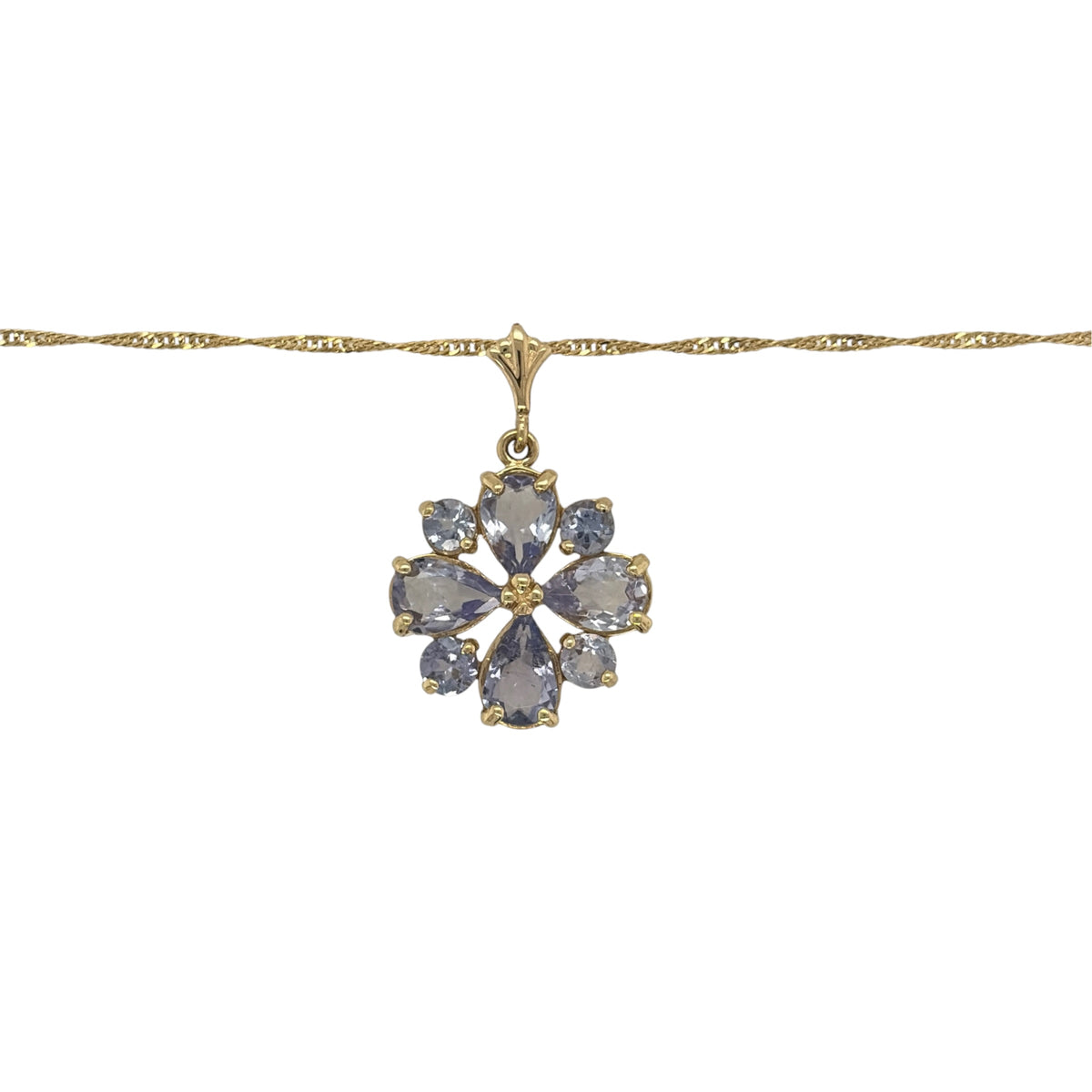 This pre-owned 14ct yellow gold tanzanite flower pendant necklace is a pretty gemstone design, featuring a floral-inspired pendant on a classic Singapore chain.

Design: Featuring a flower-shaped pendant set with tanzanite stones, this necklace has a delicate floral design finished in warm 14ct yellow gold.
Material: Made from 14-carat yellow gold.
Gemstone Detail: Set with tanzanite stones arranged to create the flower design.