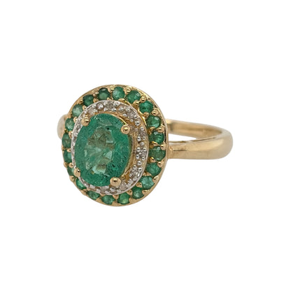 This pre-owned 9ct yellow gold diamond and emerald double halo cluster ring is a bold gemstone design, featuring an oval emerald surrounded by contrasting diamond and emerald detailing.

Design: Featuring a double halo cluster design, this ring showcases a central oval emerald surrounded by a halo of diamonds and an outer layer of emeralds, all set in warm 9ct yellow gold.
Material: Made from 9-carat yellow gold.