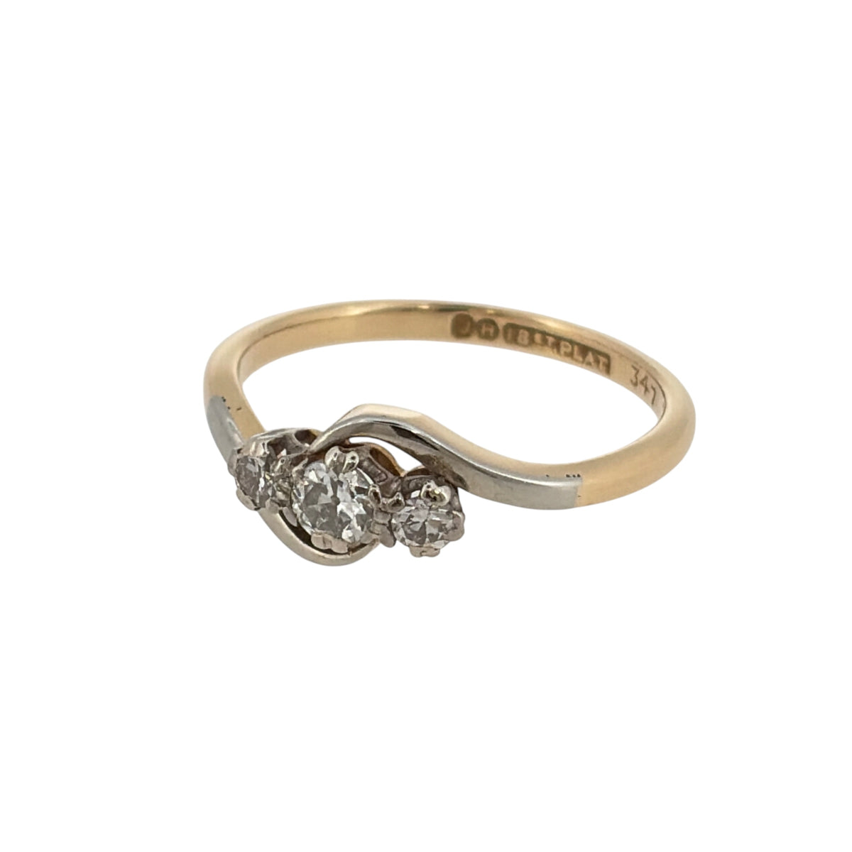 This pre-owned 18ct yellow gold and platinum diamond trilogy twist ring is a classic three-stone design, featuring diamond detailing within a flowing twist-style setting.

Design: Featuring a trilogy design with a twisted profile, this ring showcases three diamonds set in contrasting platinum with a warm 18ct yellow gold band.
Material: Made from 18-carat yellow gold and platinum.
Gemstone Detail: Set with three diamonds with approximately 0.27ct total diamond content.
