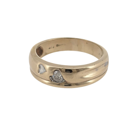 This pre-owned 9ct yellow gold diamond heart band ring is a distinctive design, featuring a brilliant cut diamond set within a heart-shaped setting.

Design: Featuring a heart-shaped design across the front, this band ring showcases a central diamond set within the heart and finished in warm 9ct yellow gold.
Material: Made from 9-carat yellow gold.
Gemstone Detail: Set with a brilliant cut diamond weighing approximately 0.15ct within a heart-shaped setting.