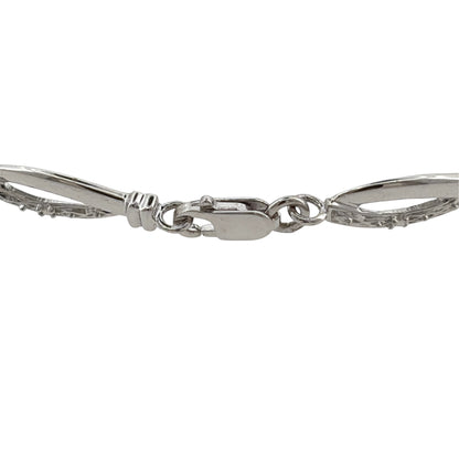 This pre-owned 9ct white gold diamond link bracelet is a classic design, featuring decorative links with diamond detailing throughout.

Design: Featuring a linked bracelet design with diamond detailing, this bracelet has a polished finish in 9ct white gold.
Material: Made from 9-carat white gold.
Gemstone Detail: Set with diamonds within the link design.
Bracelet Detail: The links measure approximately 5.5mm wide.
Size & Weight: Bracelet measures approximately 7.5 inches long. Total weight 4 grams.