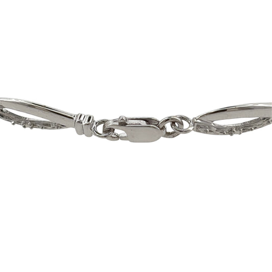 This pre-owned 9ct white gold diamond link bracelet is a classic design, featuring decorative links with diamond detailing throughout.

Design: Featuring a linked bracelet design with diamond detailing, this bracelet has a polished finish in 9ct white gold.
Material: Made from 9-carat white gold.
Gemstone Detail: Set with diamonds within the link design.
Bracelet Detail: The links measure approximately 5.5mm wide.
Size & Weight: Bracelet measures approximately 7.5 inches long. Total weight 4 grams.