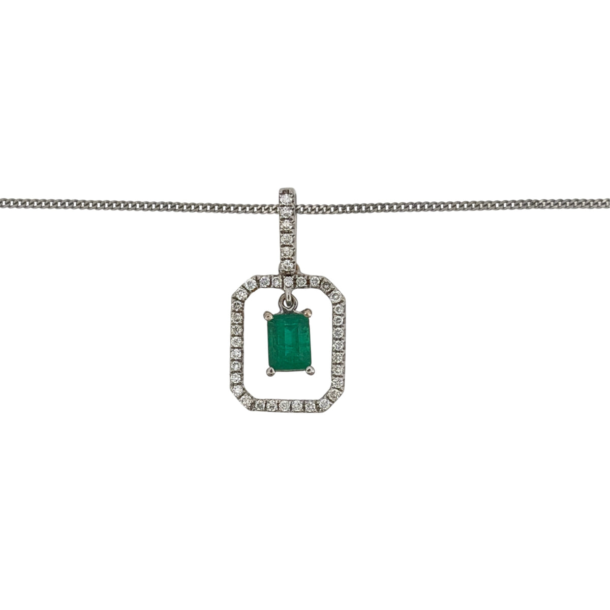 This pre-owned 18ct white gold diamond and emerald rectangular halo pendant necklace is a classic gemstone design, featuring a central emerald surrounded by diamond detailing.

Design: Featuring a rectangular halo design, this pendant showcases an emerald centre stone surrounded by diamonds, finished in polished 18ct white gold.
Material: Made from 18-carat white gold.
Gemstone Detail: Set with an emerald measuring approximately 5mm by 4mm, surrounded by a halo of diamonds.