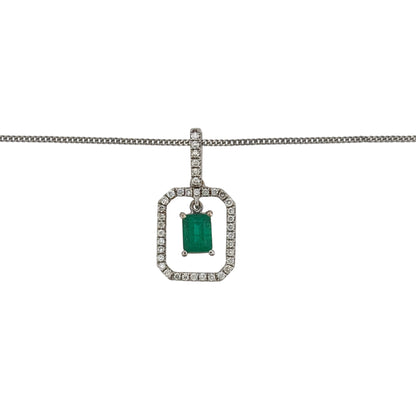 This pre-owned 18ct white gold diamond and emerald rectangular halo pendant necklace is a classic gemstone design, featuring a central emerald surrounded by diamond detailing.

Design: Featuring a rectangular halo design, this pendant showcases an emerald centre stone surrounded by diamonds, finished in polished 18ct white gold.
Material: Made from 18-carat white gold.
Gemstone Detail: Set with an emerald measuring approximately 5mm by 4mm, surrounded by a halo of diamonds.