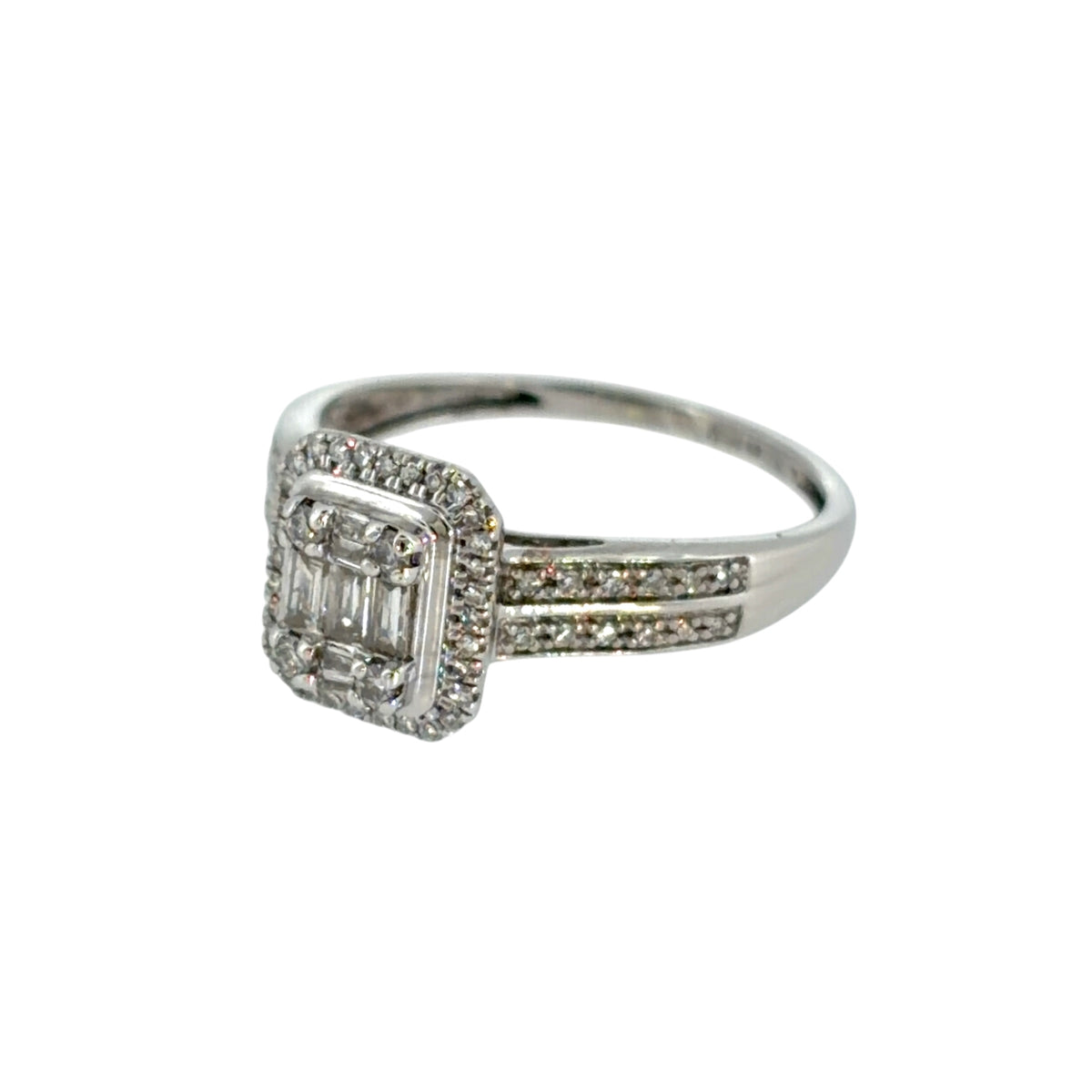 This pre-owned 9ct white gold diamond halo cluster ring is a detailed design, featuring a combination of brilliant and baguette cut diamonds with diamond-set shoulders.
Design: Featuring a halo cluster design, this ring combines brilliant and baguette cut diamonds across the centre, complemented by two rows of diamonds along the shoulders.
Material: Made from 9-carat white gold.