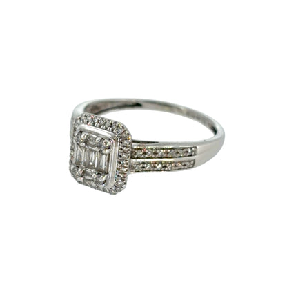 This pre-owned 9ct white gold diamond halo cluster ring is a detailed design, featuring a combination of brilliant and baguette cut diamonds with diamond-set shoulders.
Design: Featuring a halo cluster design, this ring combines brilliant and baguette cut diamonds across the centre, complemented by two rows of diamonds along the shoulders.
Material: Made from 9-carat white gold.