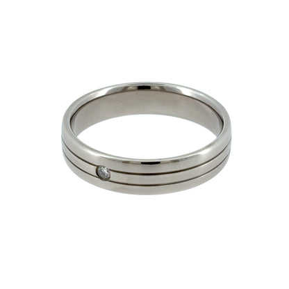 This pre-owned 9ct white gold diamond band ring is a classic design, featuring a single brilliant cut diamond set into a wider band.

Design: Featuring a simple band design with a single diamond as the focal point, this ring has a clean profile finished in polished 9ct white gold.
Material: Made from 9-carat white gold.
Gemstone Detail: Set with one brilliant cut diamond within the band.
Ring Detail: The band measures approximately 5mm wide.
Size &amp; Weight: Ring size S. Total weight 5.30 grams.