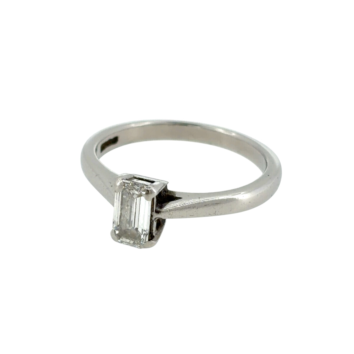 This pre-owned platinum diamond solitaire ring is a timeless design, featuring an emerald cut diamond as the central focus.
Design: Featuring a classic solitaire design, this ring showcases a single emerald cut diamond set within a polished platinum setting.
Material: Made from platinum.
Gemstone Detail: Set with an emerald cut diamond weighing approximately 0.52ct.
Ring Detail: Classic solitaire setting designed to showcase the geometric emerald cut centre diamond.