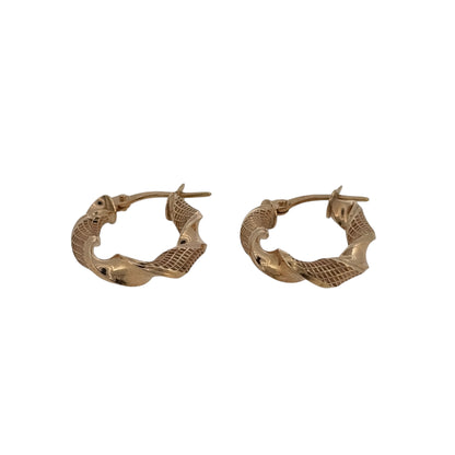 Add a subtle textured finish to your jewellery collection with these pre-owned 9ct yellow gold oval twist creole earrings, featuring a classic shape with elegant twisted detailing.

Design: The earrings feature an oval creole shape with a decorative twist design, adding texture and interest while maintaining a timeless and versatile appearance.
Material: Made from 9-carat yellow gold, the warm gold tone complements the twisted detailing and gives the earrings a classic finish.