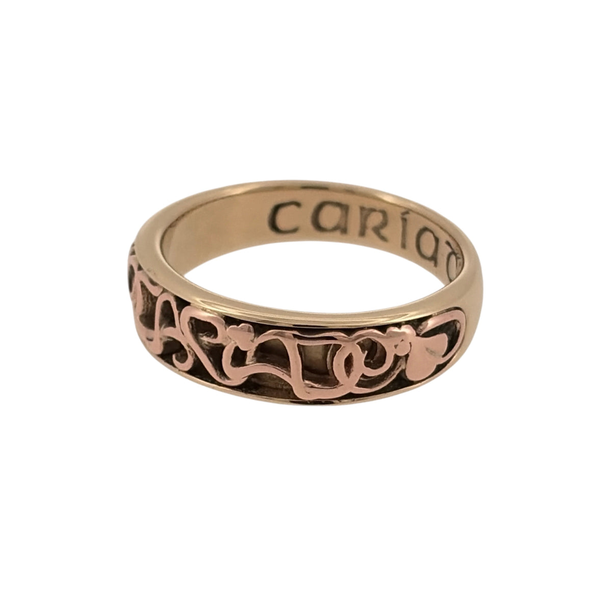 Bring heartfelt meaning and elegant design to your collection with this pre-owned 9ct yellow and rose gold Clogau Cariad band ring, symbolising love and affection—perfect for marking special moments with timeless Welsh heritage.

Design: The front of the band measures 6mm wide and features the word Cariad (Welsh for "beloved") engraved in a flowing script, framed by softly polished edges and subtle rose gold detailing for a warm, meaningful contrast.
