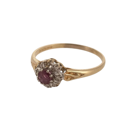 Add rich colour and classic gemstone styling to your jewellery collection with this pre-owned 9ct yellow gold diamond and ruby cluster ring, featuring a vibrant round ruby surrounded by diamonds in a timeless cluster design.

Design: The ring features a traditional cluster arrangement with a round ruby at the centre, framed by diamonds to create an elegant and eye-catching focal point.