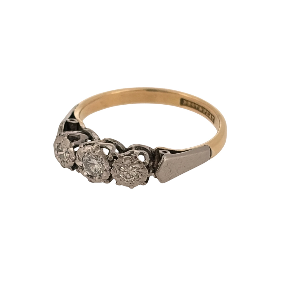 Add timeless diamond styling to your jewellery collection with this pre-owned 18ct yellow gold and platinum diamond trilogy ring, featuring three diamonds in a classic and elegant three-stone design.

Design: The ring features a traditional trilogy arrangement with three diamonds positioned across the front, creating a balanced and timeless design suitable for both everyday wear and special occasions.