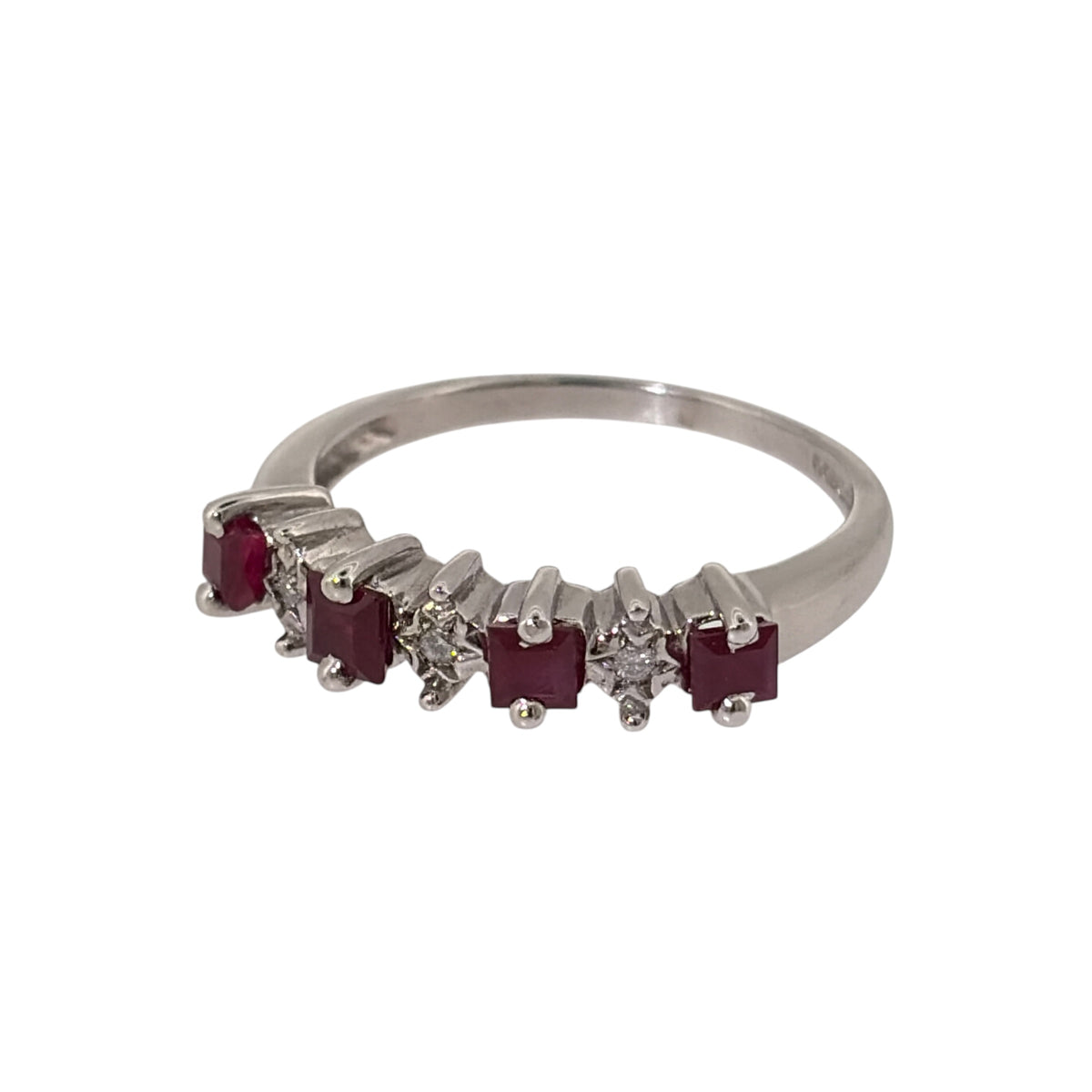Add rich colour and classic gemstone detail to your jewellery collection with this pre-owned 9ct white gold diamond and ruby band ring, featuring square rubies with illusion-set diamonds positioned between them.

Design: The ring features a gemstone band design with four square rubies arranged across the front, separated by small diamonds for a balanced combination of rich red colour and diamond detail.