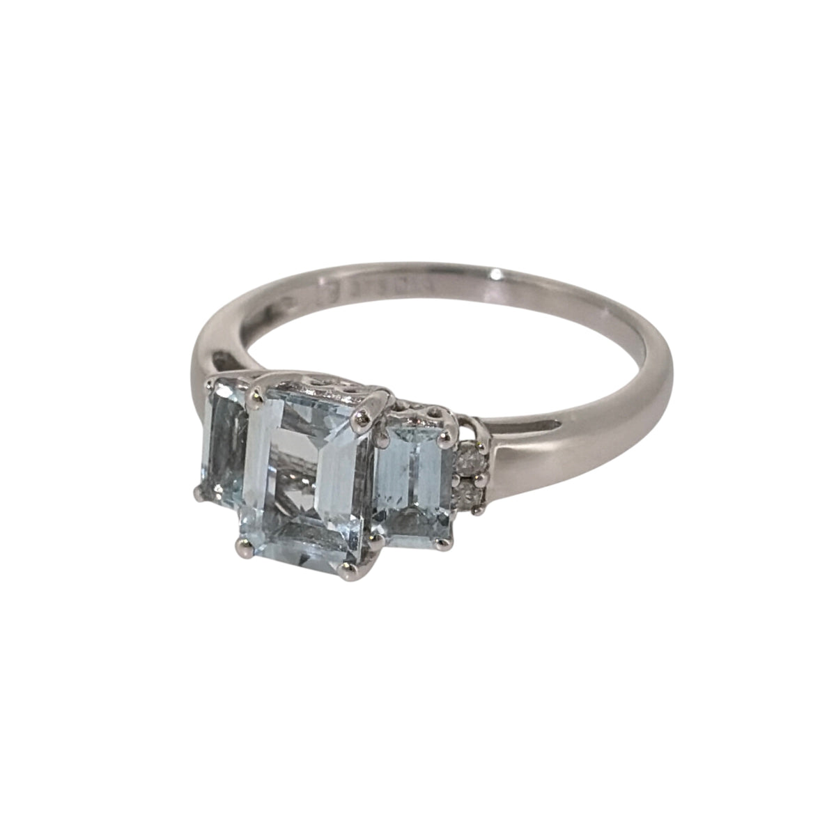 Add soft blue colour and elegant gemstone styling to your jewellery collection with this pre-owned 9ct white gold diamond and aquamarine trilogy ring, featuring three rectangular aquamarines complemented by diamond detailing.

Design: The ring features a trilogy arrangement with a larger rectangular aquamarine at the centre and a smaller matching aquamarine on either side, finished with two diamonds at each outer end.