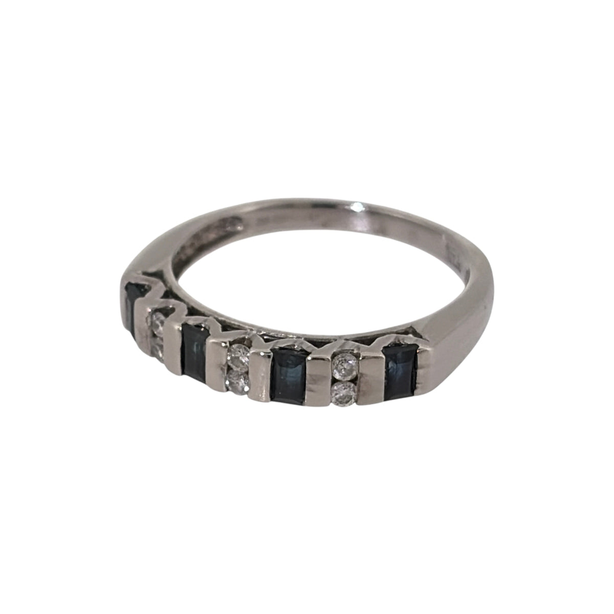 Add classic colour and timeless gemstone detail to your jewellery collection with this pre-owned 9ct white gold diamond and sapphire band ring, combining rich blue sapphire with diamond accents in an elegant and versatile design.

Design: The ring features a classic band-style design with sapphire and diamond detailing arranged across the front, creating an attractive combination of deep blue colour and contrasting diamonds.