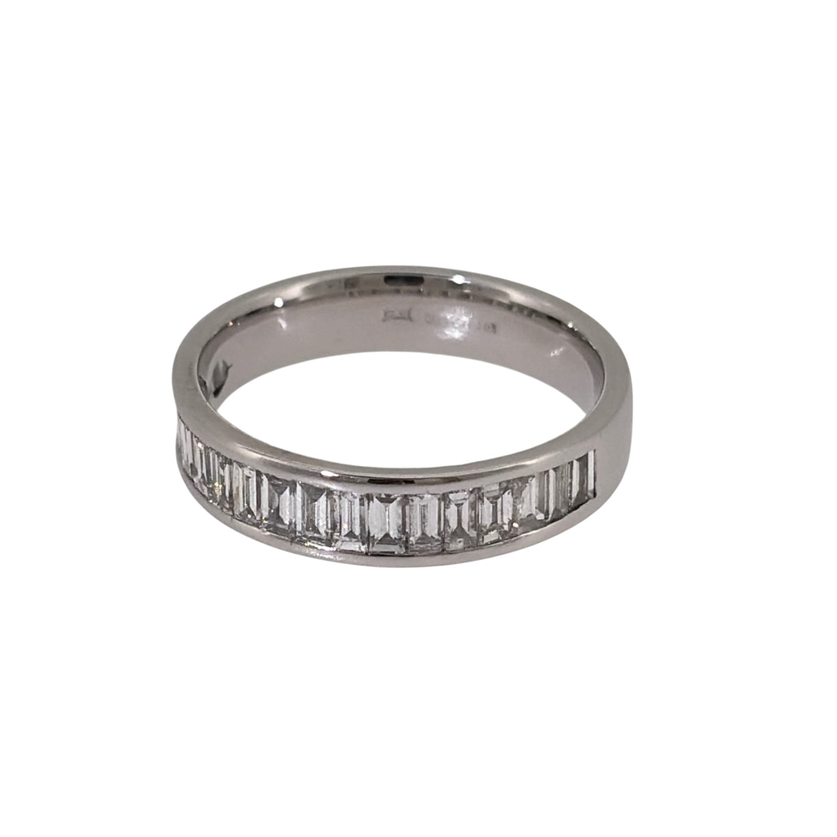 Add sleek diamond detail to your jewellery collection with this pre-owned 18ct white gold diamond band ring, featuring baguette-cut diamonds across a classic 4mm wide band.

Design: The ring features a clean band-style design with baguette-cut diamonds arranged across the front, creating a structured and contemporary appearance.
Material: Made from 18-carat white gold, the bright finish complements the diamonds and enhances the clean lines of the baguette-cut stones.