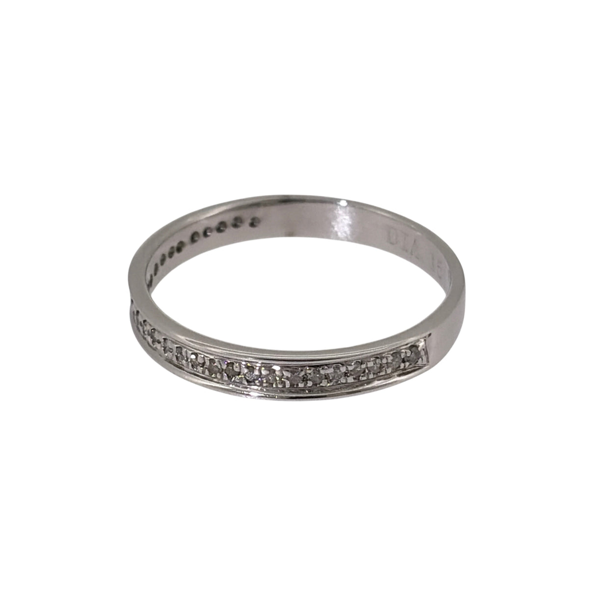 Add timeless diamond detail to your jewellery collection with this pre-owned 9ct white gold diamond band ring, featuring brilliant-cut diamonds along the centre of a classic 3mm wide band.

Design: The ring features a classic band-style design with brilliant-cut diamonds arranged through the centre, creating an elegant and versatile appearance.
Material: Made from 9-carat white gold, the bright finish complements the diamonds and gives the ring a clean and timeless look.