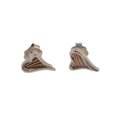 Add romantic Welsh-inspired detail to your jewellery collection with these pre-owned Clogau Heartstrings stud earrings, combining 925 sterling silver with 9ct rose gold detailing in an elegant heart-inspired design.

Design: The earrings feature Clogau’s Heartstrings design, with flowing heart-inspired detailing creating a distinctive and feminine appearance.