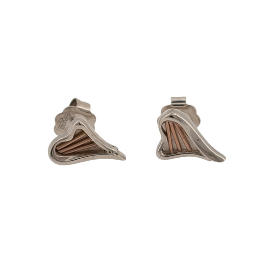 Add romantic Welsh-inspired detail to your jewellery collection with these pre-owned Clogau Heartstrings stud earrings, combining 925 sterling silver with 9ct rose gold detailing in an elegant heart-inspired design.

Design: The earrings feature Clogau’s Heartstrings design, with flowing heart-inspired detailing creating a distinctive and feminine appearance.