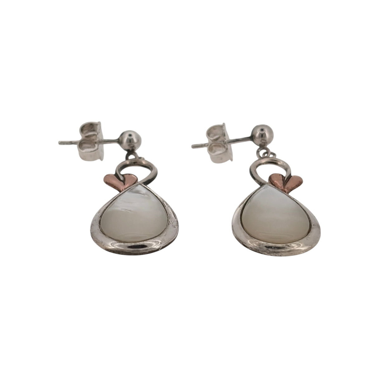 Bring natural beauty and symbolic elegance to your look with these pre-owned 925 silver and 9ct rose gold mother of pearl Clogau Tree of Life style drop earrings—perfect for adding grace and meaning to any occasion.

Design: Each earring features an elegant 13mm by 9mm oval mother of pearl stone, adorned with delicate Tree of Life detailing in warm 9ct rose gold. The lustrous pearl backdrop complements the intricate branches, symbolising growth, renewal, and connection.
