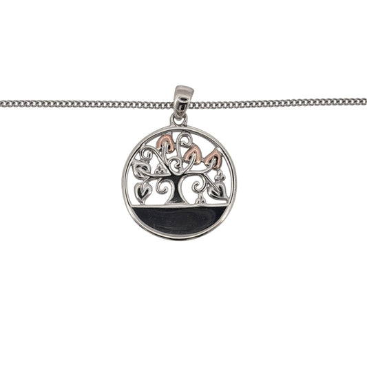 Add a classic Welsh-inspired piece to your jewellery collection with this pre-owned Clogau Round Tree of Life pendant necklace, combining 925 sterling silver with 9ct rose gold detailing.

Design: The pendant features Clogau’s recognisable Tree of Life motif within a round design, with flowing branches creating an elegant and distinctive focal point.