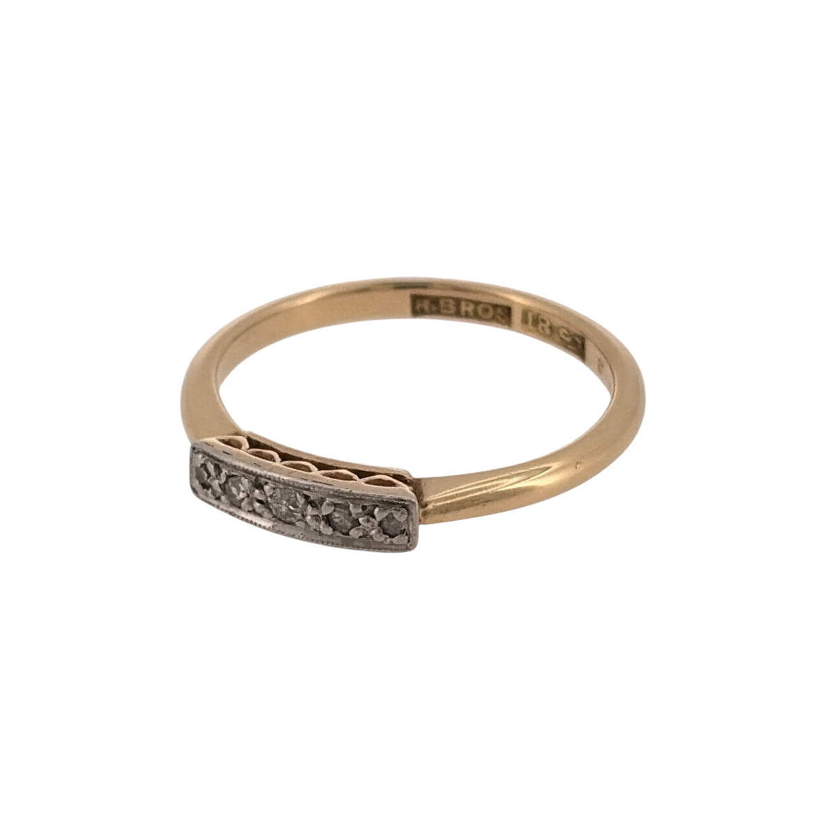 Add subtle diamond detail to your jewellery collection with this pre-owned 18ct yellow gold diamond band ring, featuring five small diamonds set across the front.

Design: The ring features a classic band design with five diamonds positioned across the front, creating a simple and elegant appearance suitable for everyday wear.
Material: Made from 18-carat yellow gold, the warm gold tone provides a timeless setting for the diamond detailing.