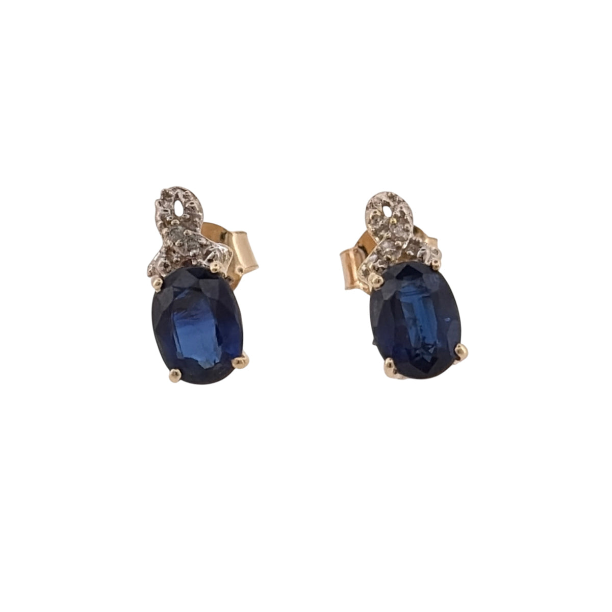 Add classic gemstone colour to your jewellery collection with these pre-owned 9ct yellow gold diamond and sapphire stud earrings, featuring oval sapphires complemented by diamond detailing.

Design: The earrings feature an elegant stud design, with an oval sapphire forming the central focal point of each earring and diamond detailing adding a classic finishing touch.
Material: Made from 9-carat yellow gold, the warm gold tone complements the rich colour of the sapphires and surrounding diamond accents.