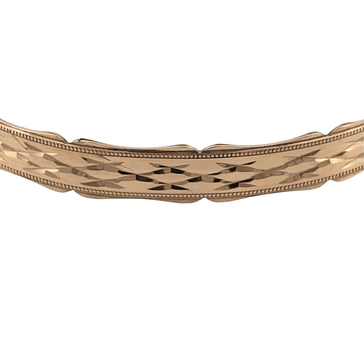 Add a substantial gold piece to your jewellery collection with this pre-owned 9ct yellow solid gold bangle, featuring decorative patterning and distinctive scalloped edges.

Design: The bangle features a patterned finish with scalloped edging, adding texture and decorative detail to the classic gold bangle design.
Material: Made from solid 9-carat yellow gold, the bangle has a warm gold finish and a substantial feel.