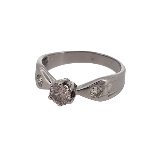 Add classic diamond elegance to your jewellery collection with this pre-owned 14ct white gold solitaire ring, featuring a central brilliant-cut diamond complemented by a brilliant-cut diamond on each shoulder.

Design: The ring features a classic solitaire-style design, with a central diamond forming the main focal point and additional diamonds set into the shoulders for extra detail.