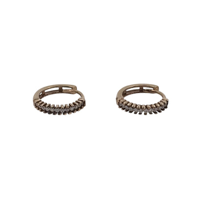Add classic diamond detail to your jewellery collection with these pre-owned 9ct yellow gold diamond huggie earrings, featuring a compact and easy-to-wear hoop design.

Design: The earrings feature a classic huggie-style design, sitting close to the ear for a neat and versatile appearance suitable for everyday wear.
Material: Made from 9-carat yellow gold, the warm gold tone provides a timeless setting for the diamond detailing.