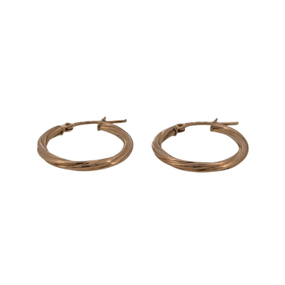 Add classic gold detail to your jewellery collection with these pre-owned 9ct yellow gold twisted hoop creole earrings, featuring a decorative twist design in a versatile size.

Design: The earrings feature a classic creole hoop shape with a twisted finish, adding texture and detail to the traditional gold hoop design.
Material: Made from 9-carat yellow gold, the warm gold tone highlights the twisted detailing and gives the earrings a timeless appearance.