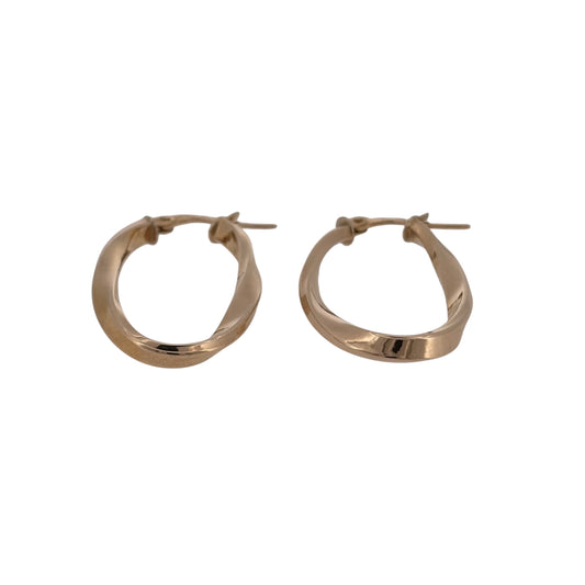 Add classic gold detail to your jewellery collection with these pre-owned 9ct yellow gold twisted oval creole earrings, featuring an elongated shape with decorative twisted detailing.

Design: The earrings feature an oval creole design with a twisted finish, adding texture and interest to the classic gold hoop style.
Material: Made from 9-carat yellow gold, the warm gold tone highlights the twisted detailing and gives the earrings a timeless finish.