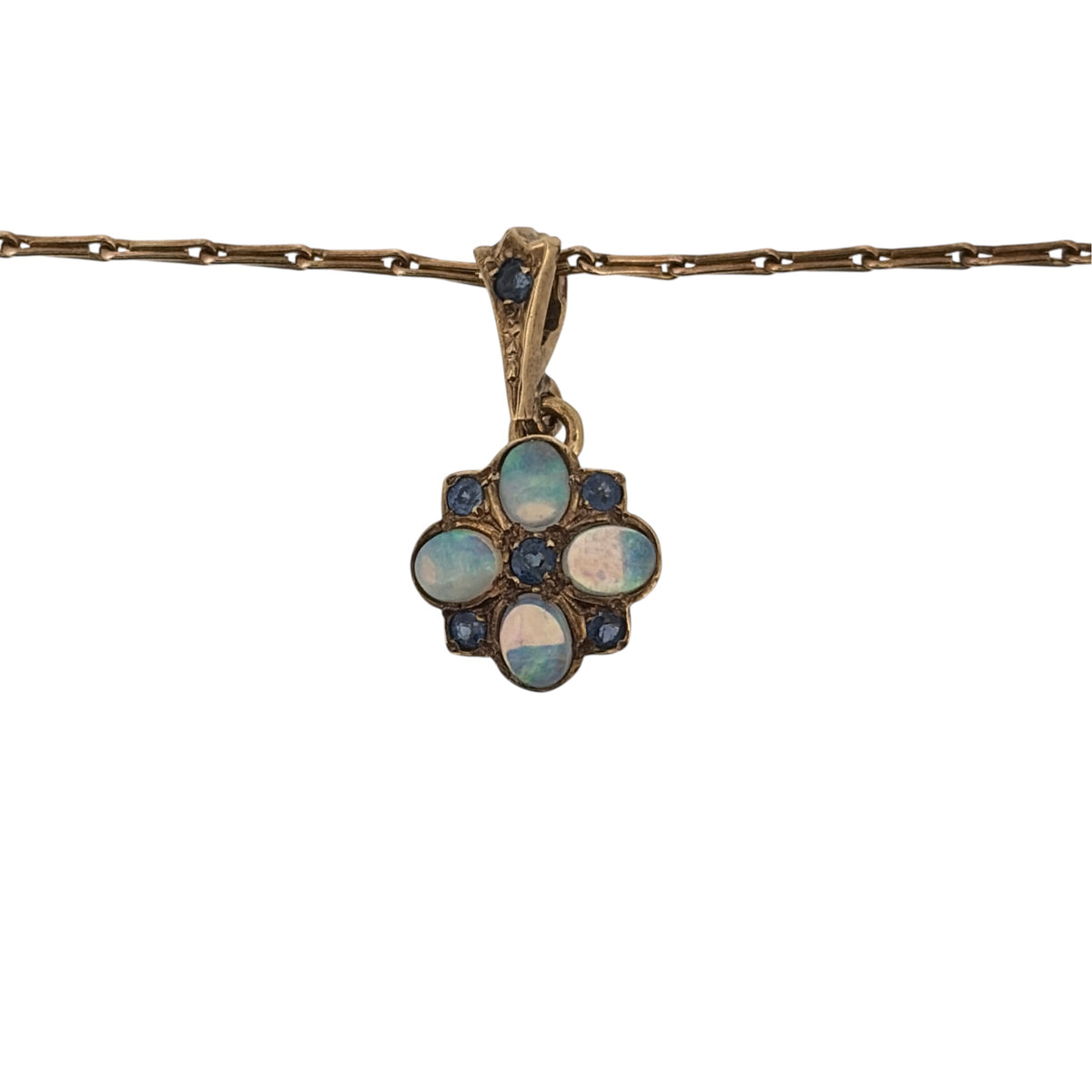 Add colourful floral detail to your jewellery collection with this pre-owned 9ct yellow gold Opalique and sapphire flower pendant necklace, suspended from a decorative 20-inch fancy link chain.

Design: The pendant features a flower-inspired design, combining Opalique and sapphire stones to create a colourful and distinctive floral focal point.
Material: Made from 9-carat yellow gold, the warm gold tone complements the contrasting colours of the Opalique and sapphire stones.