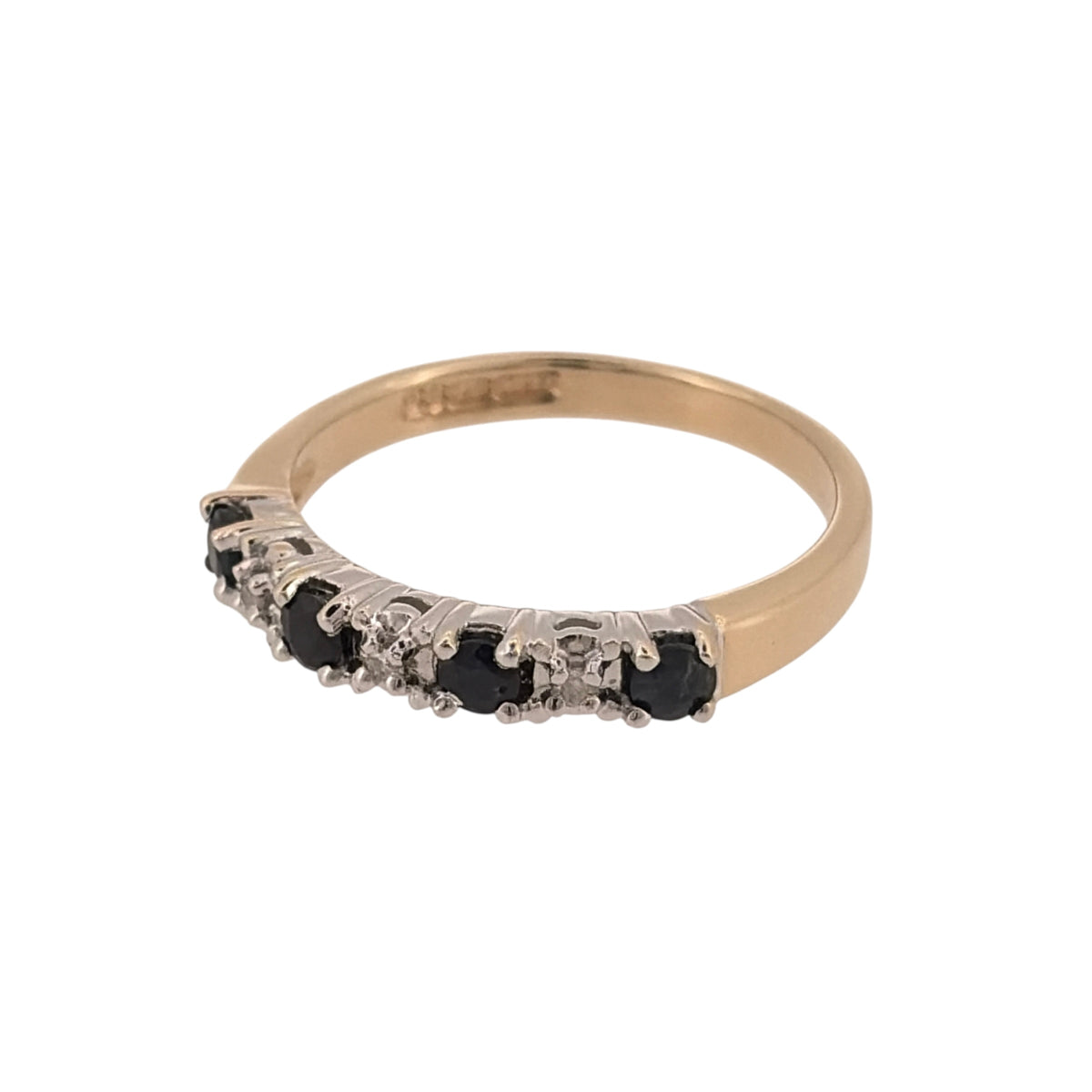 Add classic gemstone colour to your jewellery collection with this pre-owned 9ct yellow gold diamond and sapphire band ring, featuring four round sapphires with diamond detailing.

Design: The ring features a classic gemstone-set band design, combining sapphires and diamonds across the front for an elegant and timeless appearance.
Material: Made from 9-carat yellow gold, the warm gold tone complements the rich blue colour of the sapphires and the diamond detailing.