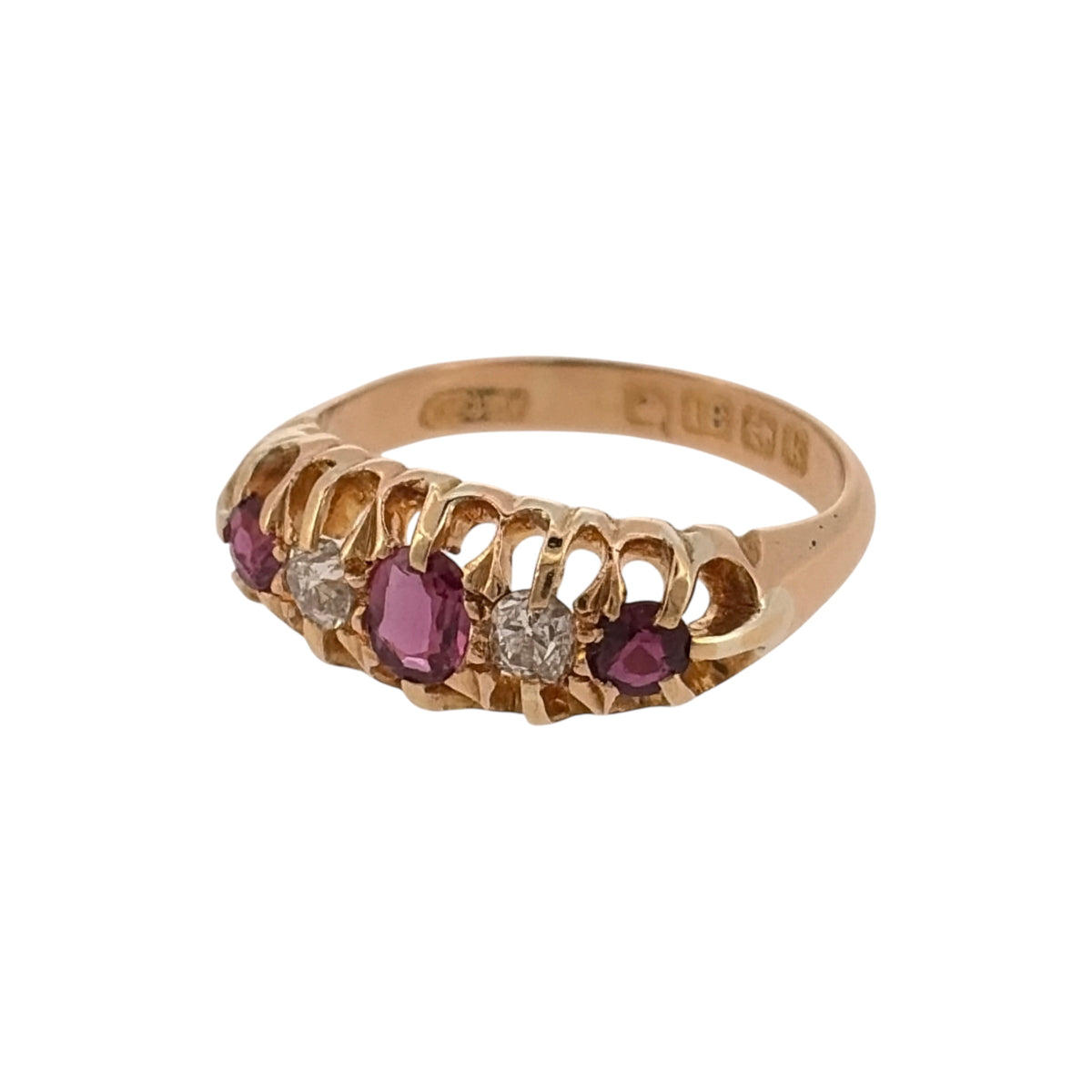 Add vintage-inspired colour to your jewellery collection with this pre-owned 18ct yellow gold diamond and ruby band ring, combining rich ruby tones with approximately 0.12ct of diamond detailing.

Design: The ring features a vintage-style band design, with ruby and diamond detailing arranged across the front for a traditional and decorative appearance.
Material: Made from 18-carat yellow gold, the warm gold tone complements the rich red colour of the rubies and the diamond detailing.