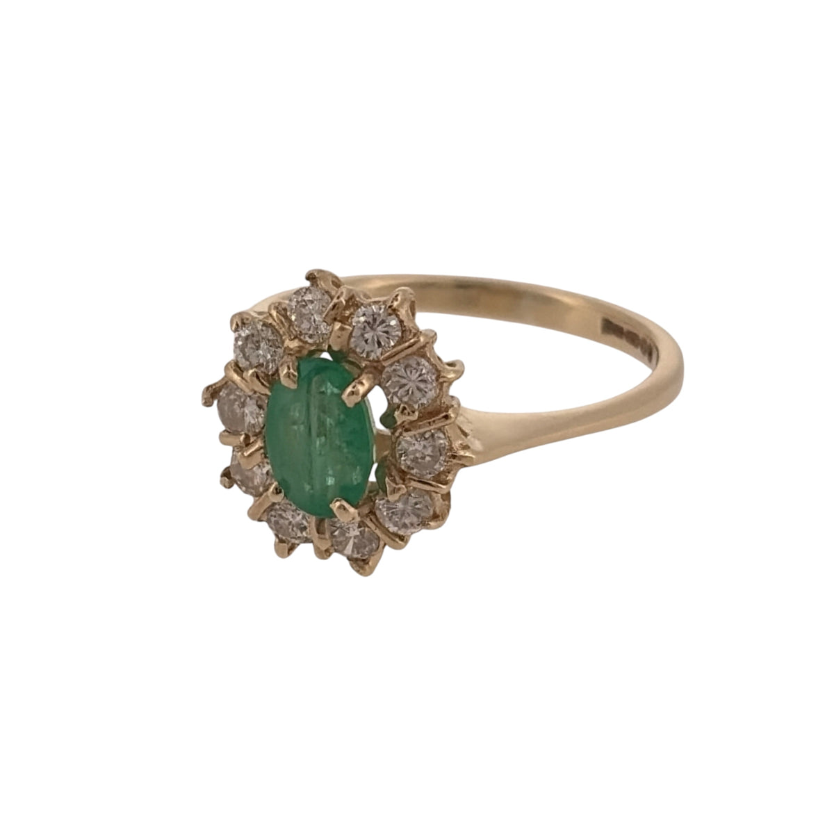 Add classic gemstone colour to your jewellery collection with this pre-owned 9ct yellow gold diamond and emerald cluster ring, featuring an oval emerald surrounded by diamond detailing.

Design: The ring features a traditional cluster design, with an oval emerald forming the central focal point and diamond detailing arranged around it.
Material: Made from 9-carat yellow gold, the warm gold tone complements the rich green colour of the emerald and the surrounding diamonds.