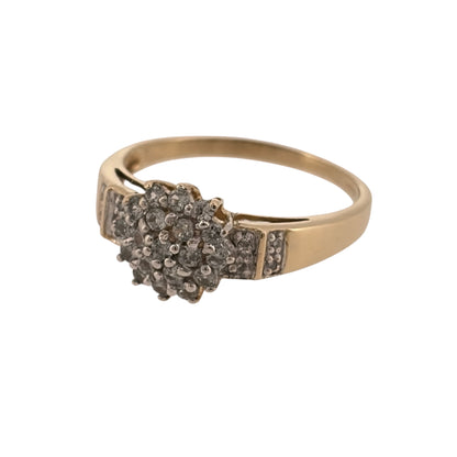 Add classic diamond detail to your jewellery collection with this pre-owned 9ct yellow gold diamond cluster ring, featuring a prominent central cluster with additional diamonds set along the shoulders.

Design: The ring features a classic cluster design, with multiple diamonds grouped together at the centre and further diamond detailing extending onto the shoulders.
Material: Made from 9-carat yellow gold, the warm gold tone provides a timeless setting for the diamond detailing.