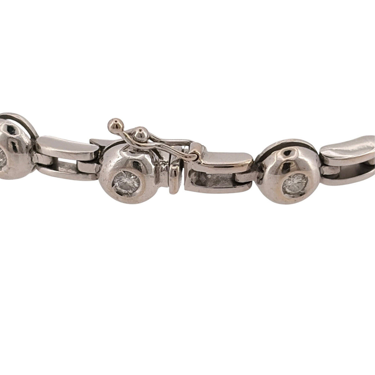 Add a substantial diamond piece to your jewellery collection with this pre-owned 18ct white gold rubover-set bracelet, featuring fourteen brilliant-cut diamonds with approximately 0.56ct of diamond content in total.

Design: The bracelet features a bold link design with fourteen brilliant-cut diamonds individually rubover set throughout, combining a substantial profile with classic diamond detailing.