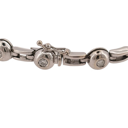 Add a substantial diamond piece to your jewellery collection with this pre-owned 18ct white gold rubover-set bracelet, featuring fourteen brilliant-cut diamonds with approximately 0.56ct of diamond content in total.

Design: The bracelet features a bold link design with fourteen brilliant-cut diamonds individually rubover set throughout, combining a substantial profile with classic diamond detailing.