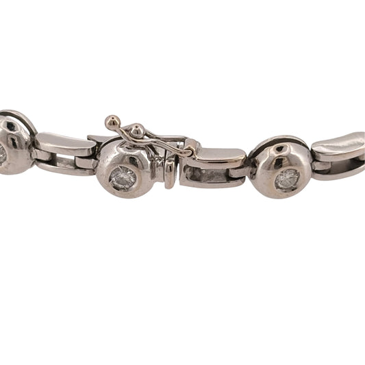 Add a substantial diamond piece to your jewellery collection with this pre-owned 18ct white gold rubover-set bracelet, featuring fourteen brilliant-cut diamonds with approximately 0.56ct of diamond content in total.

Design: The bracelet features a bold link design with fourteen brilliant-cut diamonds individually rubover set throughout, combining a substantial profile with classic diamond detailing.