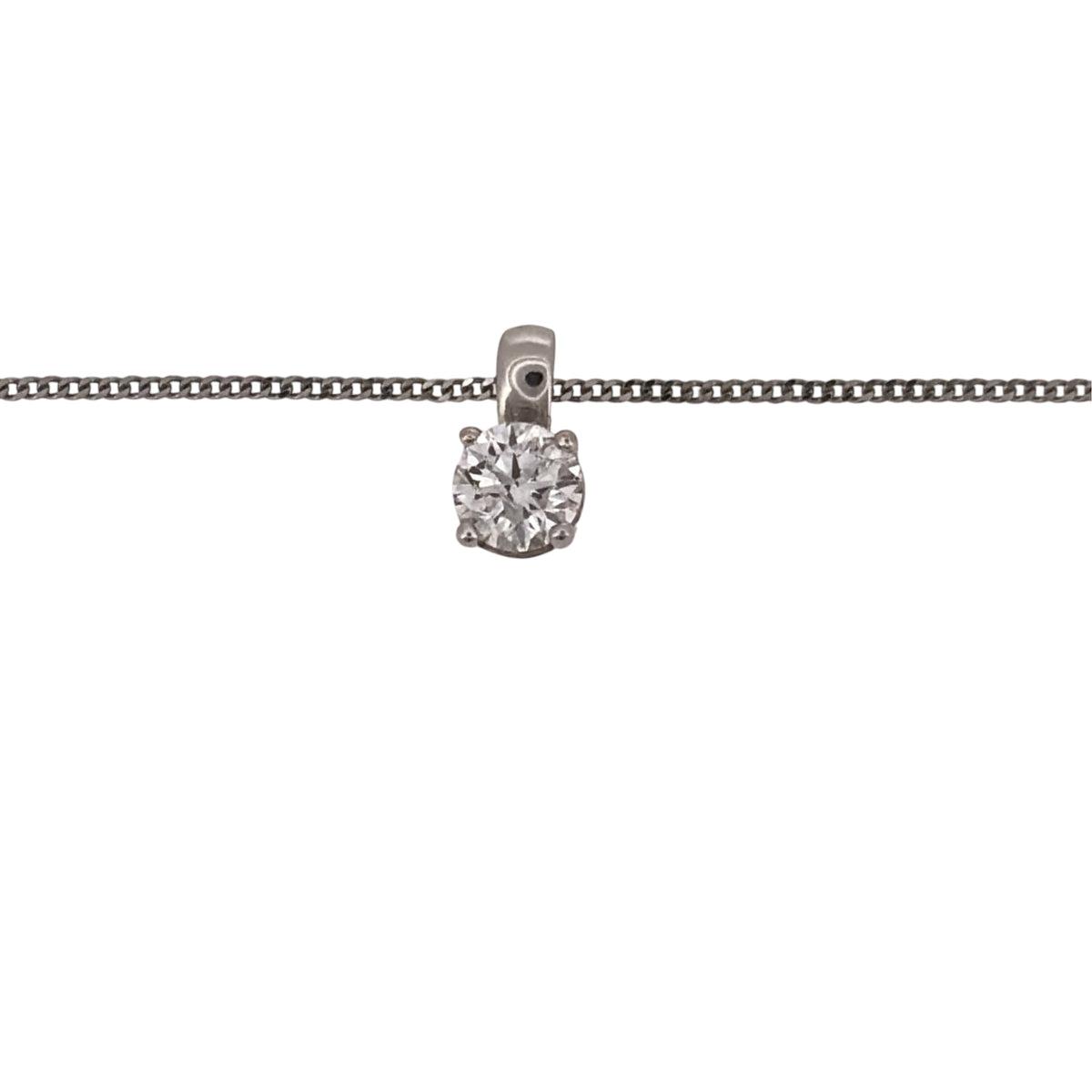 Add a timeless diamond piece to your jewellery collection with this pre-owned 18ct white gold diamond solitaire pendant, presented on a fine 18-inch curb chain.

Design: The necklace features a classic solitaire pendant design, with a single brilliant-cut diamond forming the focal point and suspended from a fine curb chain.
Material: Made from 18-carat white gold, the bright white finish provides a classic setting for the diamond.