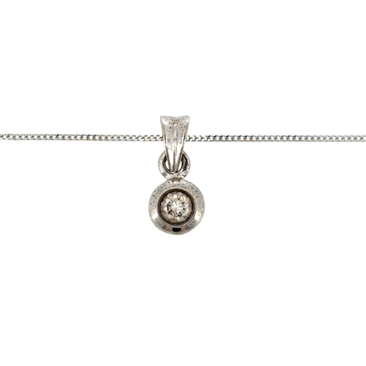 Add classic diamond detail to your jewellery collection with this pre-owned 9ct white gold diamond solitaire pendant, featuring a rubover-set brilliant-cut diamond on a fine 18-inch curb chain.

Design: The necklace features a classic solitaire pendant design, with a single brilliant-cut diamond held within a neat rubover setting and suspended from a fine curb chain.
Material: Made from 9-carat white gold, the bright white finish complements the diamond and gives the necklace a timeless appearance.