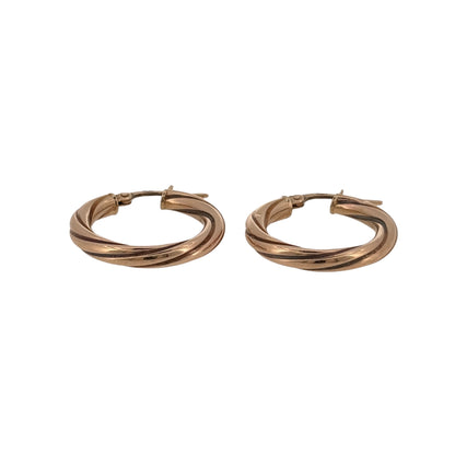 Add classic gold detail to your jewellery collection with these pre-owned 9ct yellow gold twisted hoop creole earrings.

Design: The earrings feature a classic round hoop creole shape with a twisted design, adding texture and detail to a versatile style.
Material: Made from 9-carat yellow gold, the warm gold tone complements the twisted detailing and gives the earrings a timeless finish.
Earring Detail: Each hoop creole measures approximately 21mm in diameter, creating a neat and wearable profile.