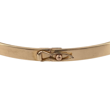 Add a timeless gold staple to your jewellery collection with this pre-owned 9ct yellow gold plain hinged bangle, featuring a simple and versatile design.

Design: The bangle features a classic plain profile with a hinged design, offering a clean and understated appearance suitable for regular wear.
Material: Made from 9-carat yellow gold, the warm gold tone gives the bangle a traditional and versatile finish.
