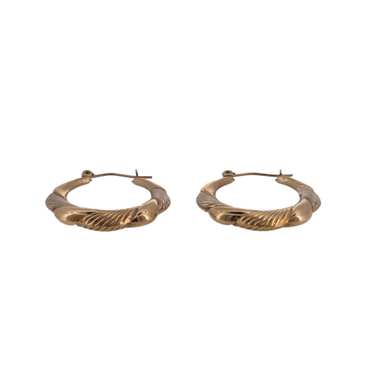 Add a distinctive two-tone design to your jewellery collection with these pre-owned 9ct yellow and white gold squared twisted hoop creole earrings.

Design: The earrings feature a squared hoop creole shape with a twisted design, combining contrasting gold tones for a detailed and distinctive appearance.
Material: Made from 9-carat yellow and white gold, the two-tone finish highlights the twisted detailing and squared profile.