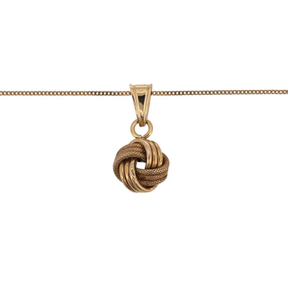 Add classic gold detail to your jewellery collection with this pre-owned 9ct yellow gold textured knot pendant, presented on a fine 18-inch curb chain.

Design: The necklace features a decorative knot-style pendant with a textured finish, creating a detailed yet versatile appearance.
Material: Made from 9-carat yellow gold, the warm gold tone highlights the textured detailing of the knot design.
Pendant Detail: The knot pendant measures approximately 1.9cm long including the bail by 9mm wide.