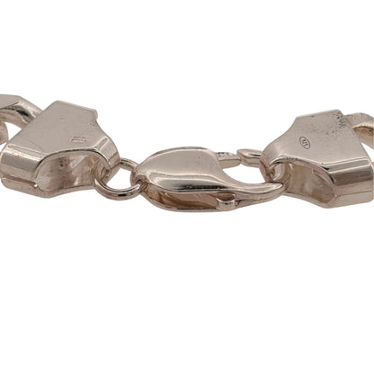 Add a bold silver piece to your jewellery collection with this pre-owned 925 sterling silver curb bracelet, featuring a substantial 12mm link width and classic design.

Design: The bracelet features a traditional curb link design, with its wide links creating a bold and timeless appearance suitable for wearing alone as a statement piece.
Material: Made from 925 sterling silver, the bright silver finish complements the classic curb link design.