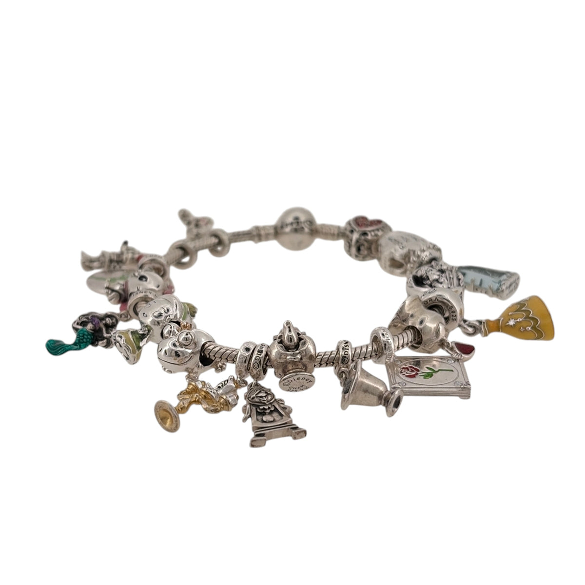 Add a magical piece to your jewellery collection with this pre-owned 925 sterling silver Pandora Disney charm bracelet, featuring eighteen Disney-themed charms on a classic Pandora bracelet.

Design: The bracelet features a traditional Pandora charm bracelet design, decorated with eighteen Disney charms that create a fun and distinctive appearance inspired by beloved Disney characters and stories.
Material: Made from 925 sterling silver.