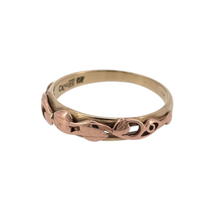 Bring meaningful symbolism and elegant two-tone style to your collection with this pre-owned 9ct yellow and rose gold Clogau Tree of Life band ring—an iconic design celebrating growth, strength, and connection.

Design: The front of the band measures 5mm wide and features the signature Tree of Life motif, with flowing branches and leaves creating a beautifully detailed and expressive pattern. The balanced design offers timeless appeal with symbolic depth.